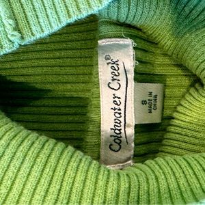 Darker green turtle neck